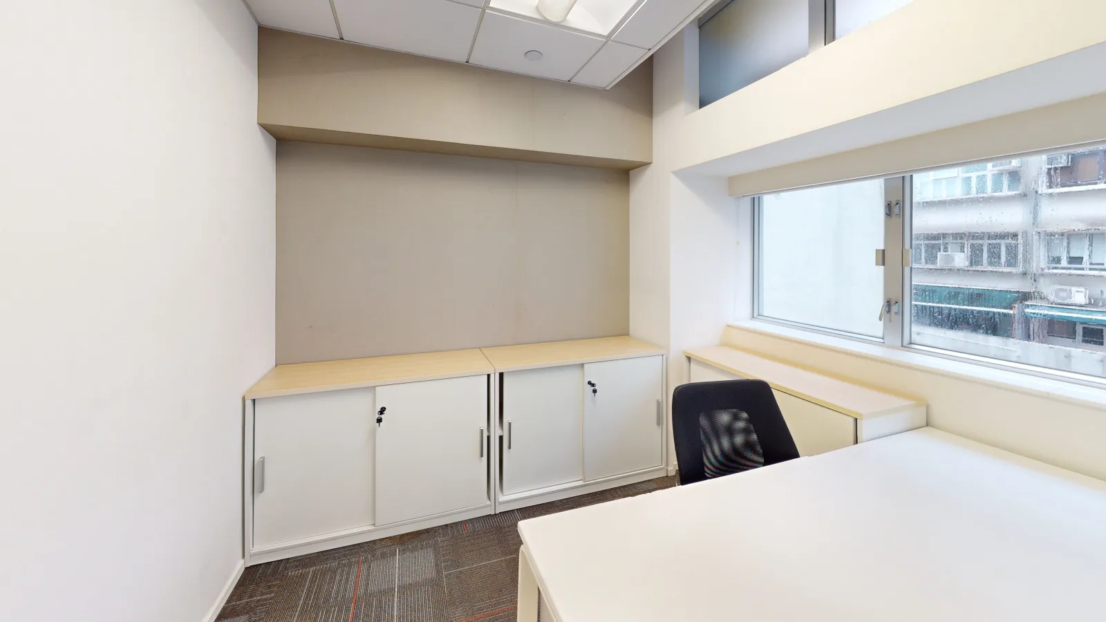 Office for lease on Wing Lok Street, Sheung Wan - desk area toward windows