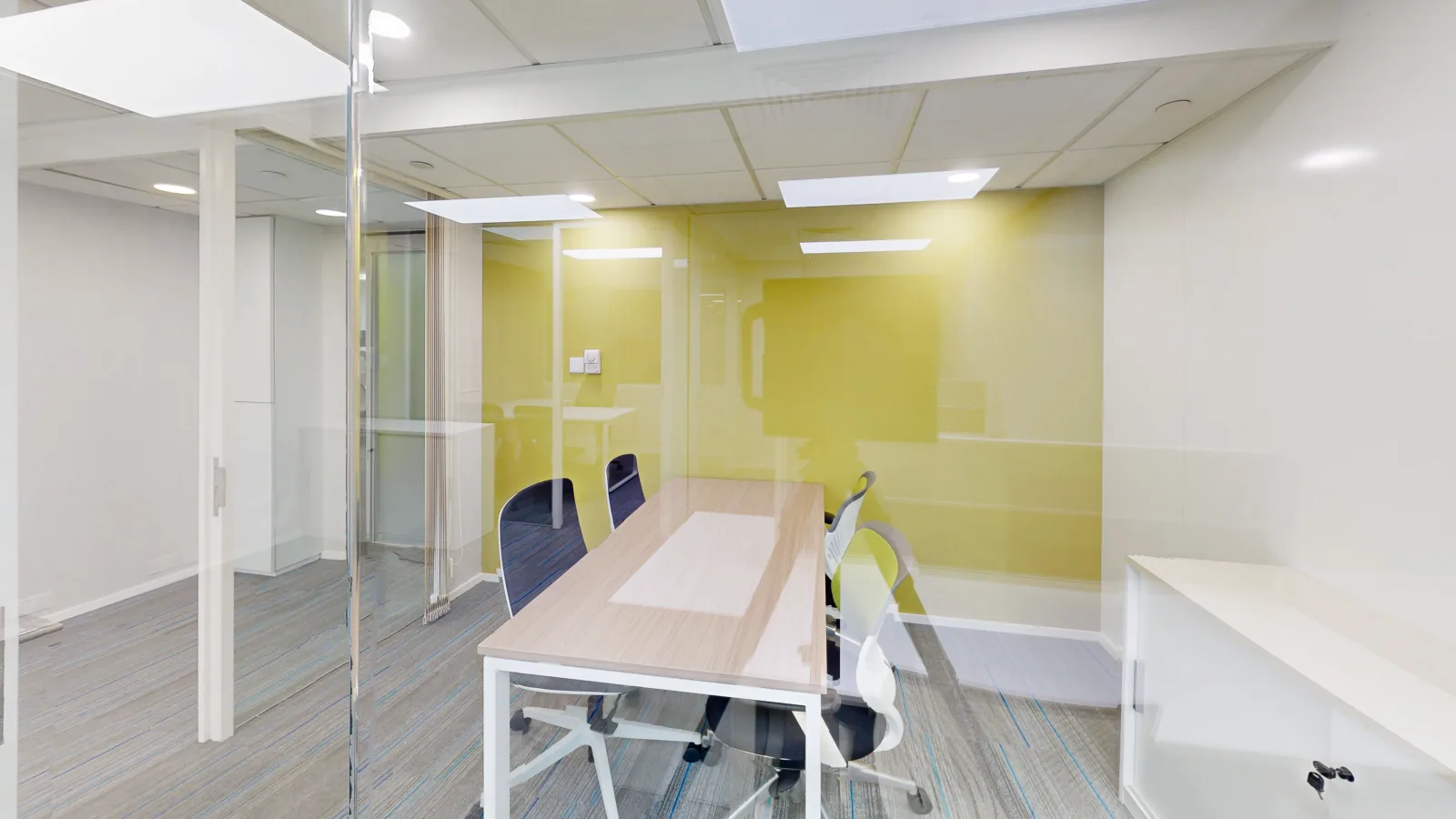 Office for lease on Hennessy Road, Wan Chai - desk area toward windows