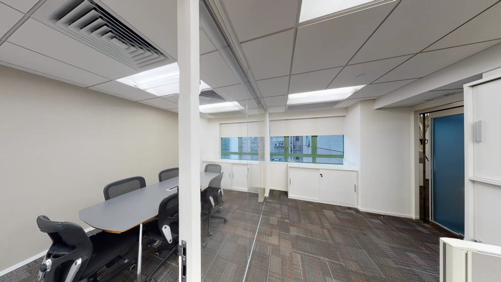 Office for lease on Hennessy Road, Wan Chai - desk area toward windows