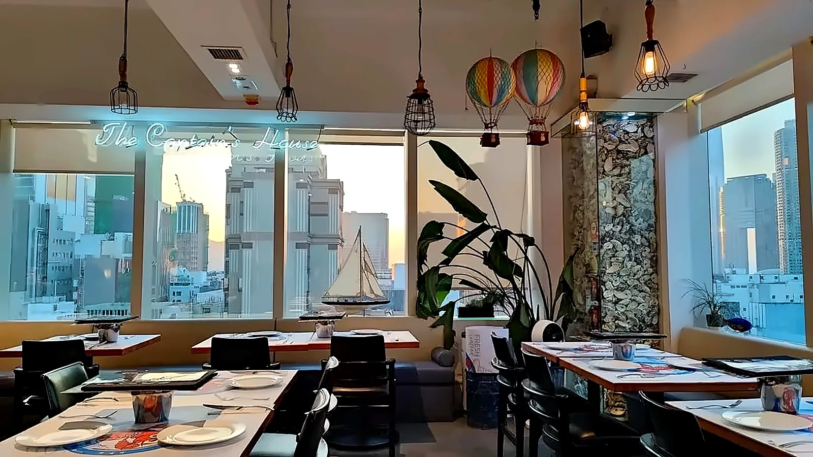 Restaurant dining area with city view at H8, Tsim Sha Tsui