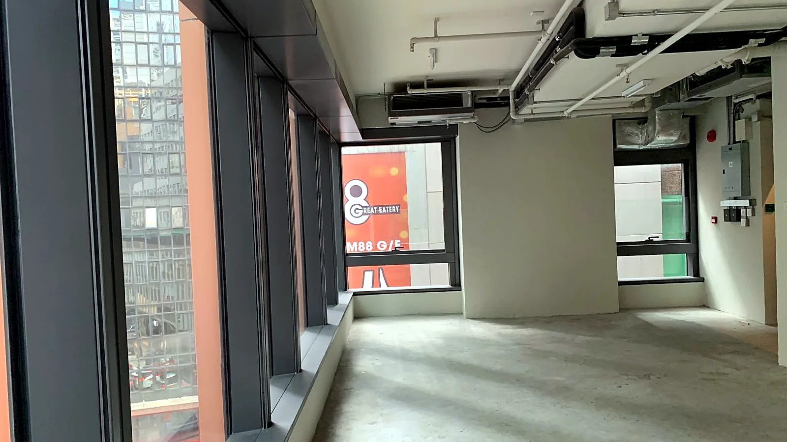 Bare-shell office interior with windows and exposed services, Wellington Street, Central