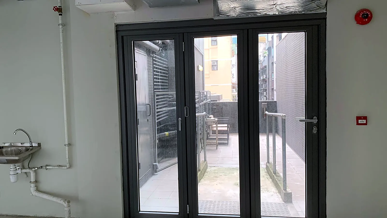 Private flat roof terrace viewed through bifold doors, Wellington Street, Central