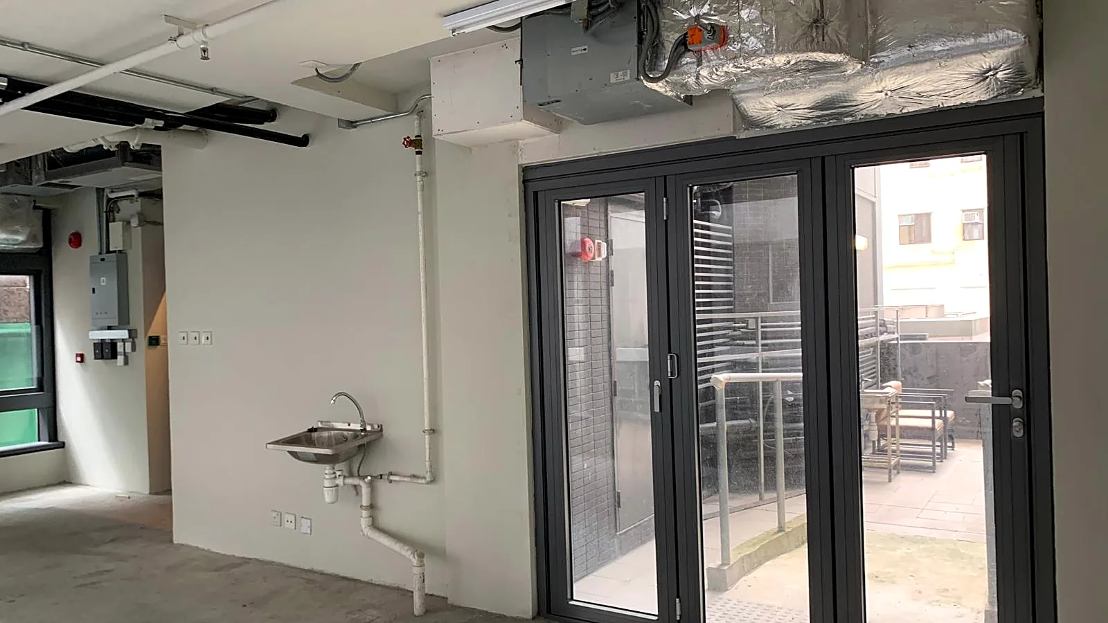 Glass bifold doors to a private flat roof terrace, office for lease in Central