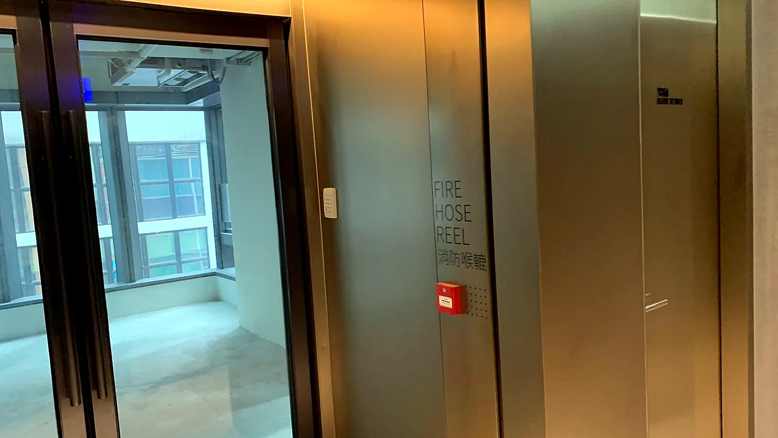 Fourth-floor lift lobby and glazed unit entrance, Wellington Street, Central