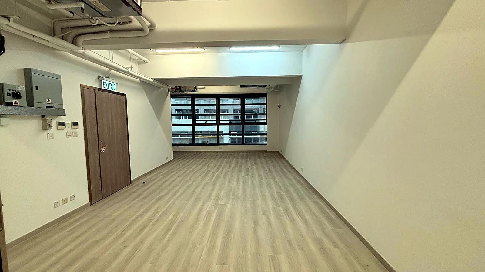 Office interior at Wing Lok Street, Sheung Wan - open-plan fitted space toward window