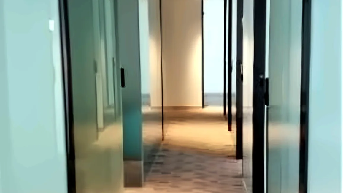 Office at Cubus, Causeway Bay – glass-door hallway