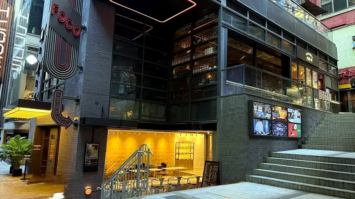Restaurant at FOCO, Central — FOCO building exterior at dusk