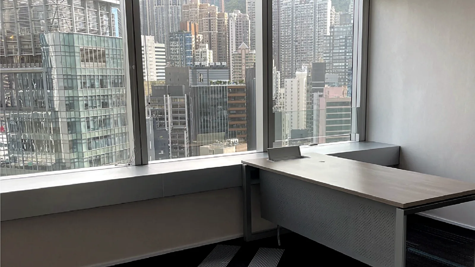 Fitted office desk with city view at The Center, Central