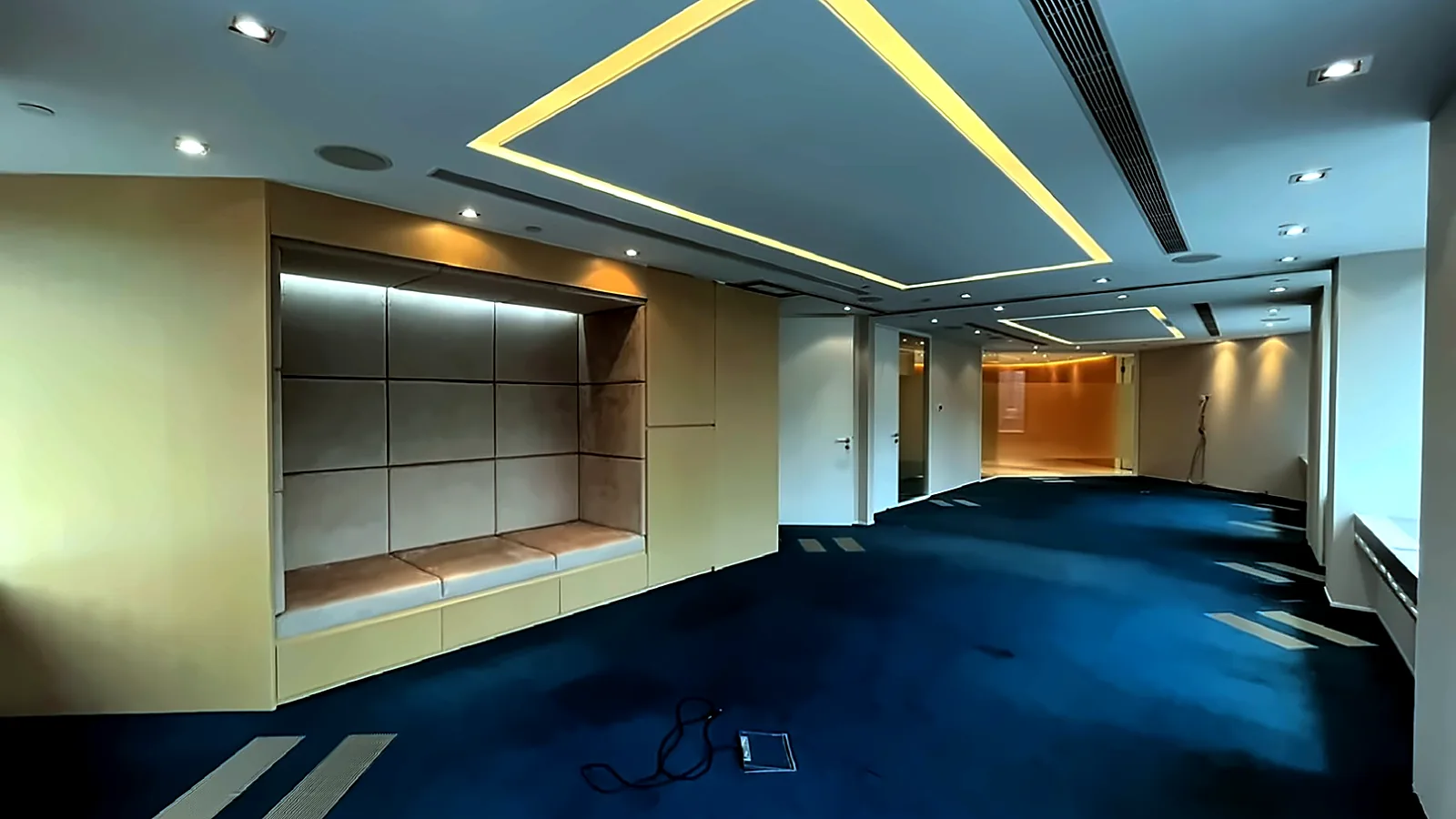 Teal carpet breakout nook in fitted office at The Center, Central