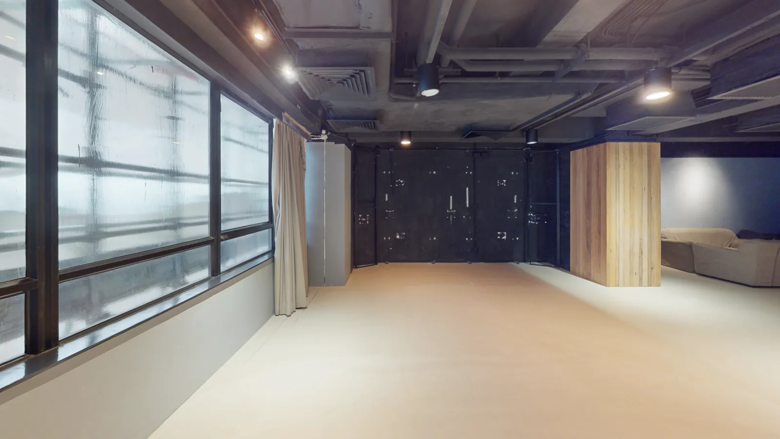 Office at Lee Garden Six, Causeway Bay – open industrial shell toward doors/windows