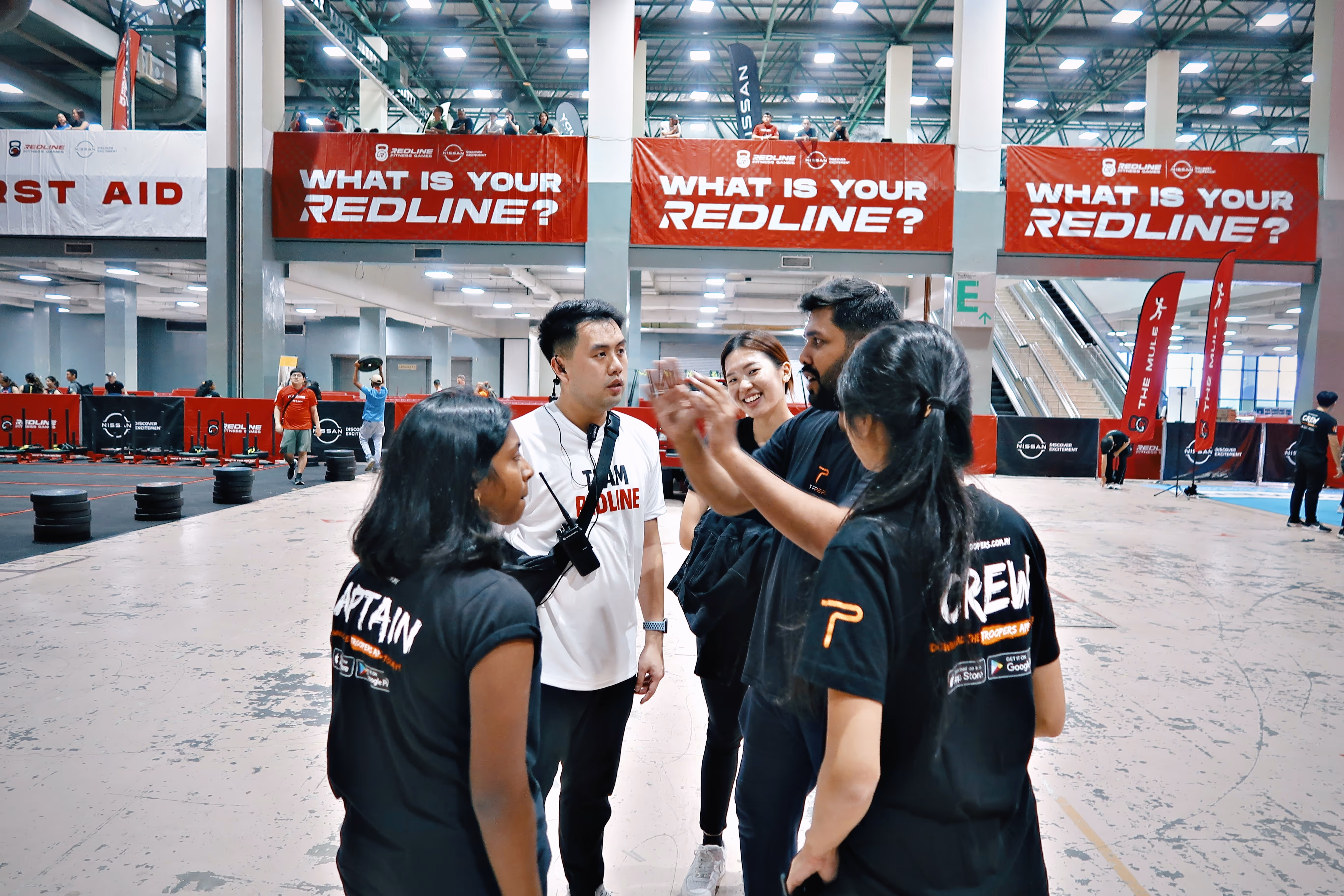 TROOPERS part-time workers in a team discussion at the Redline event.