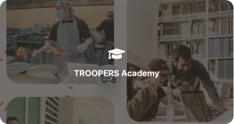 TROOPERS part-time workers engaging in a team discussion, showcasing collaboration and community at the workplace in Malaysia.