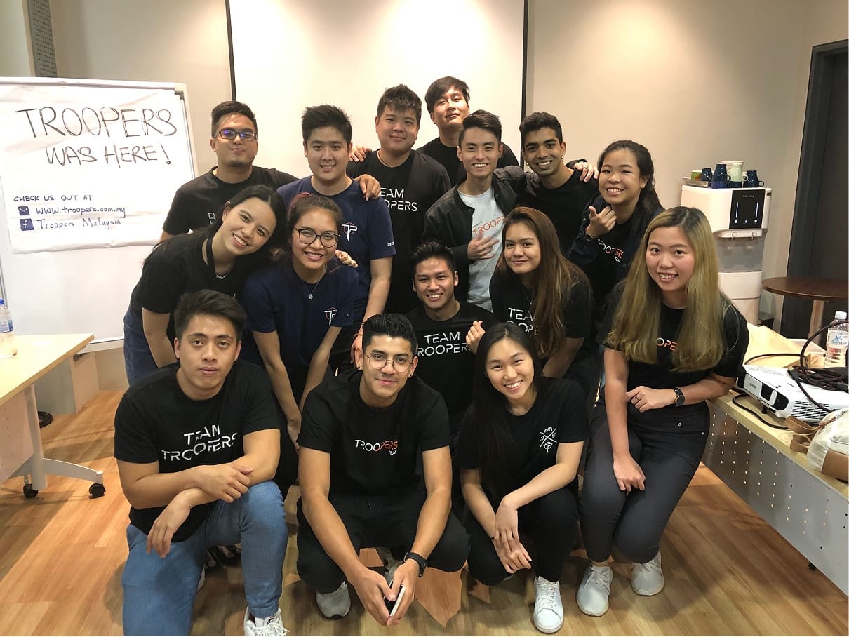 TROOPERS team standing in front of the TROOPERS logo during the company's founding in July 2017
