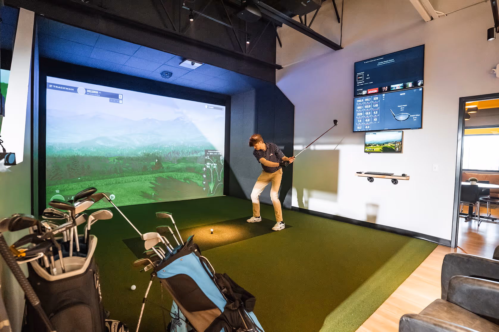 Player on the Indoor Golf Simulator