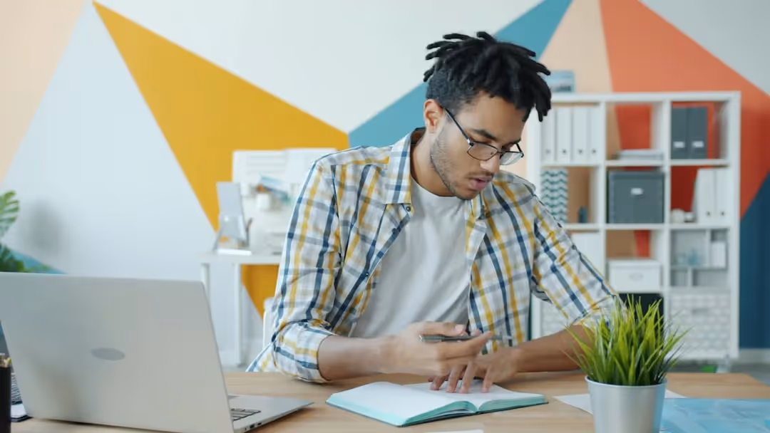 Person reviewing franchise disclosure documents at a desk