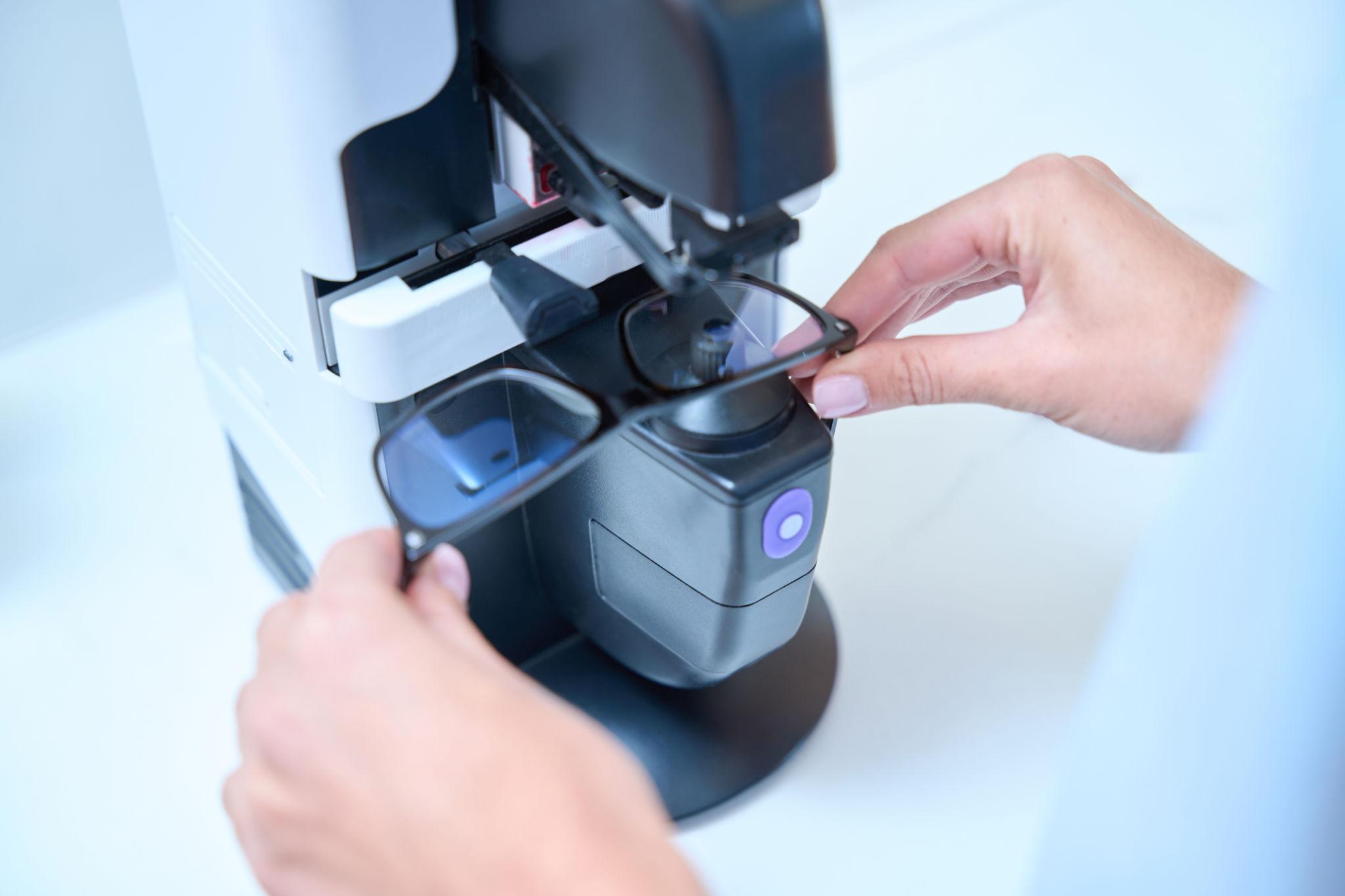 Optician adjusting eyewear frames at Peter Jackson Opticians Leicester
