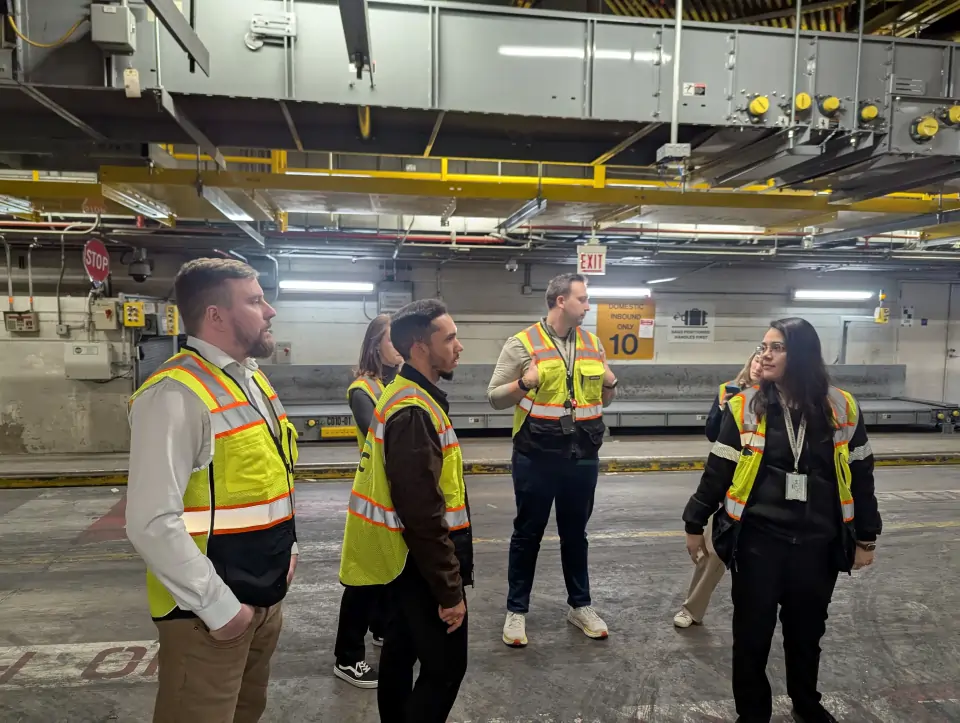 Author and team tour the baggage handling area