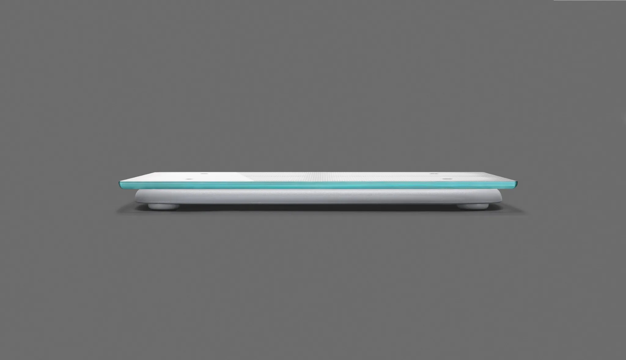 Side profile of the Bodyport Cardiac Scale showing its slim glass platform