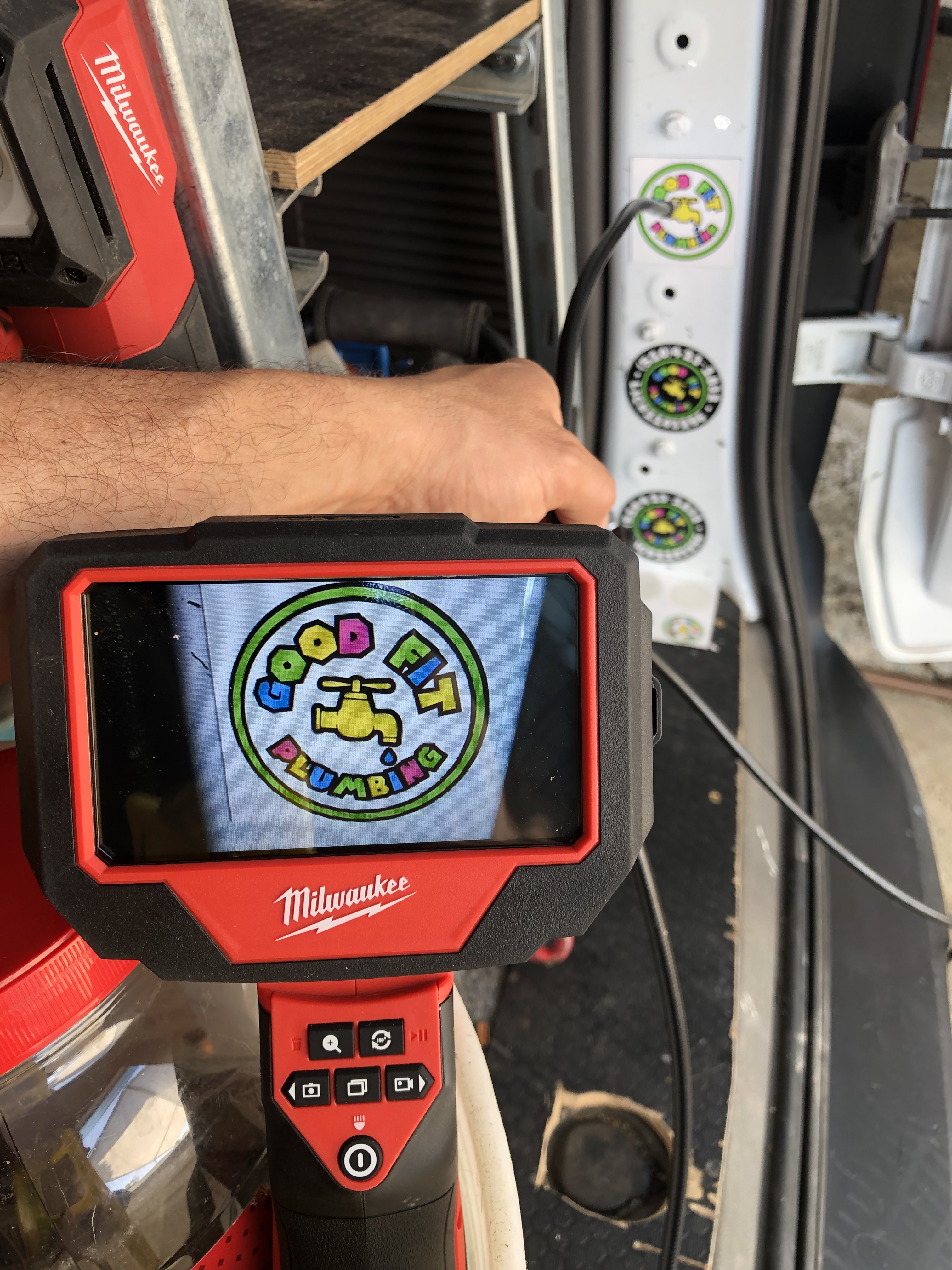 An inspection camera showing the Good Fit Plumbing logo, illustrating the thorough inspection and diagnostic tools provided for plumbing systems.