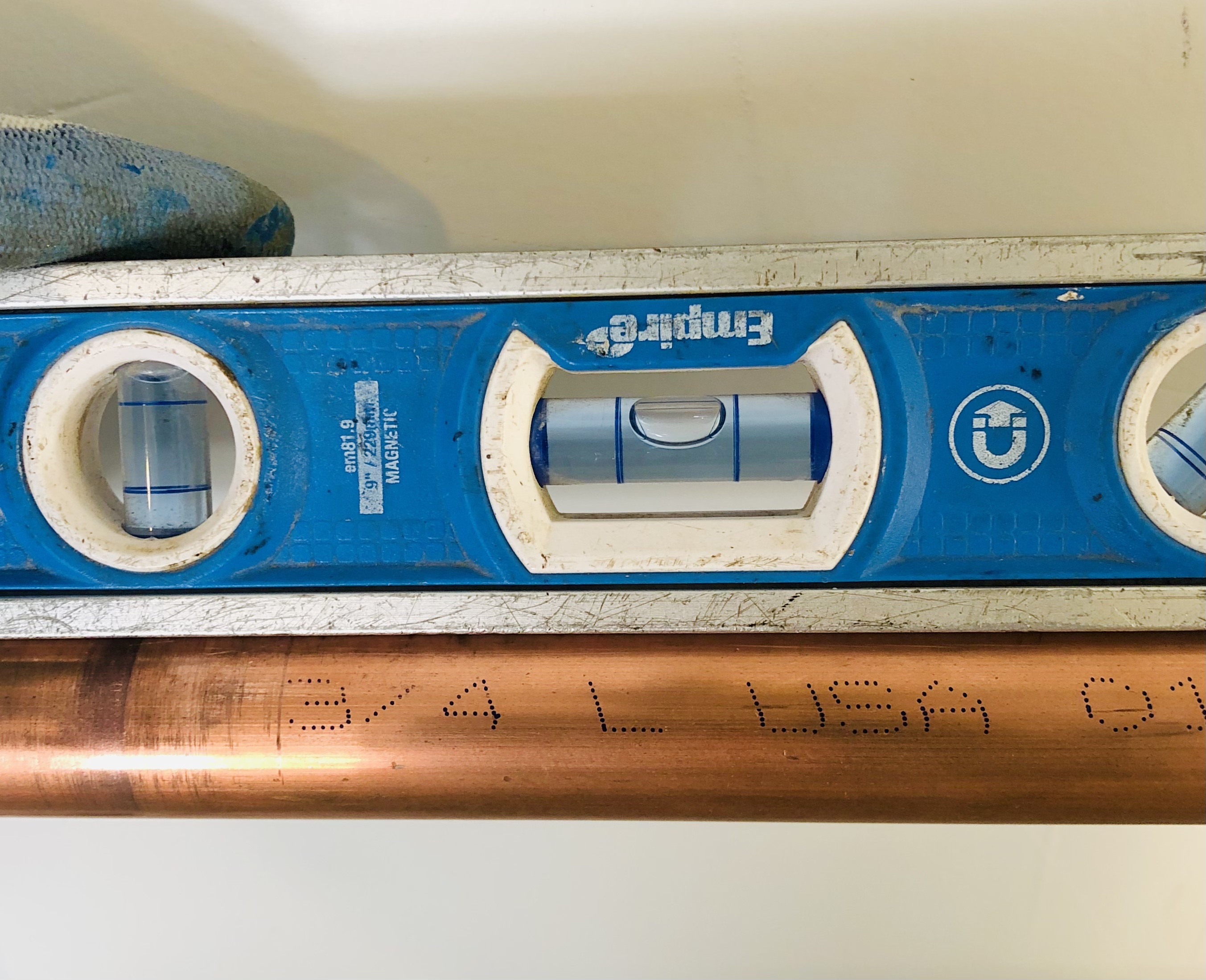 Neatly arranged copper pipes, symbolizing repiping services that involve replacing old or damaged plumbing pipes for better efficiency and durability.