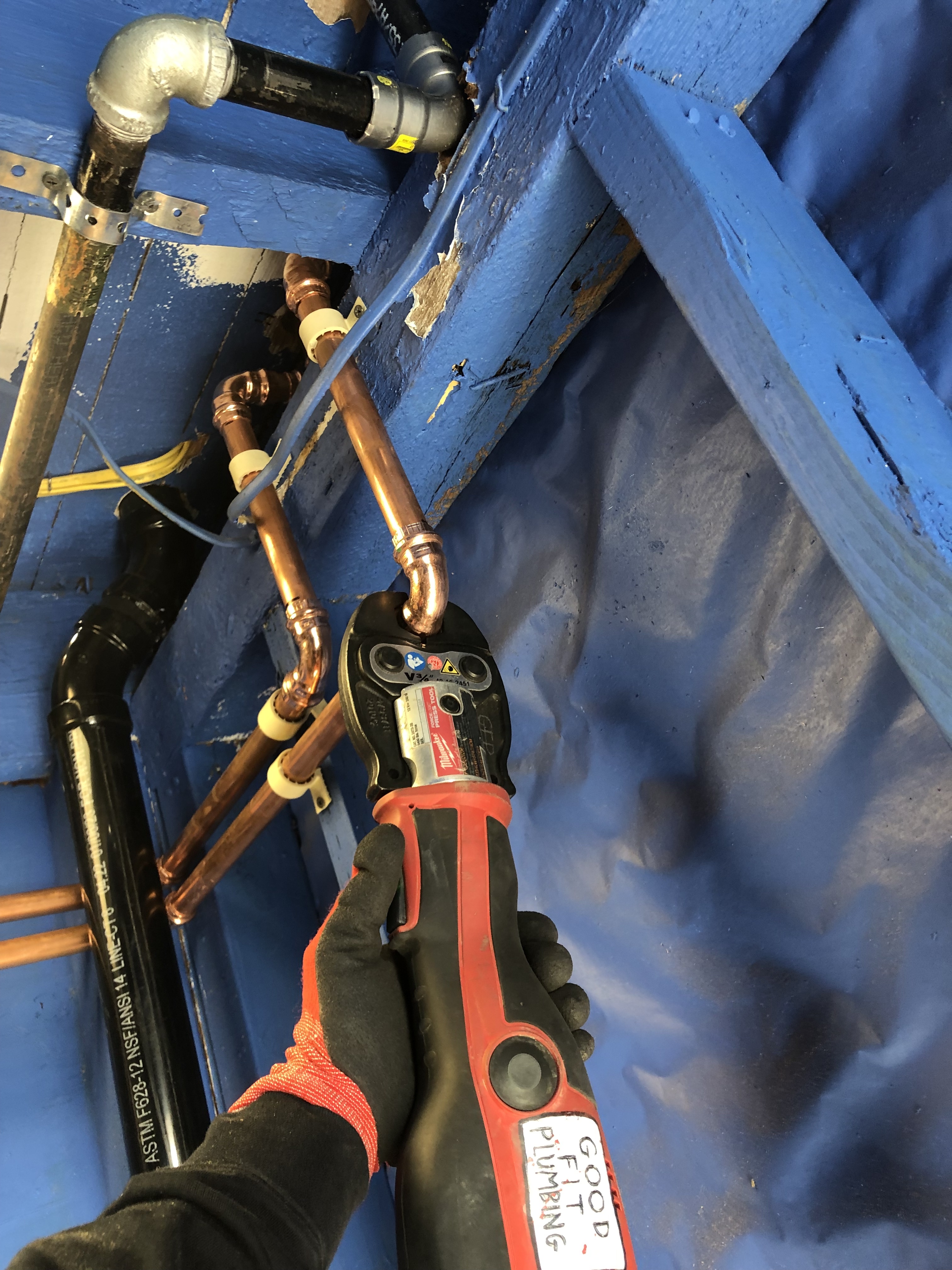 Professionally installed residential water heater, highlighting the Good Fit Plumbing brand's water heater installation and maintenance services.