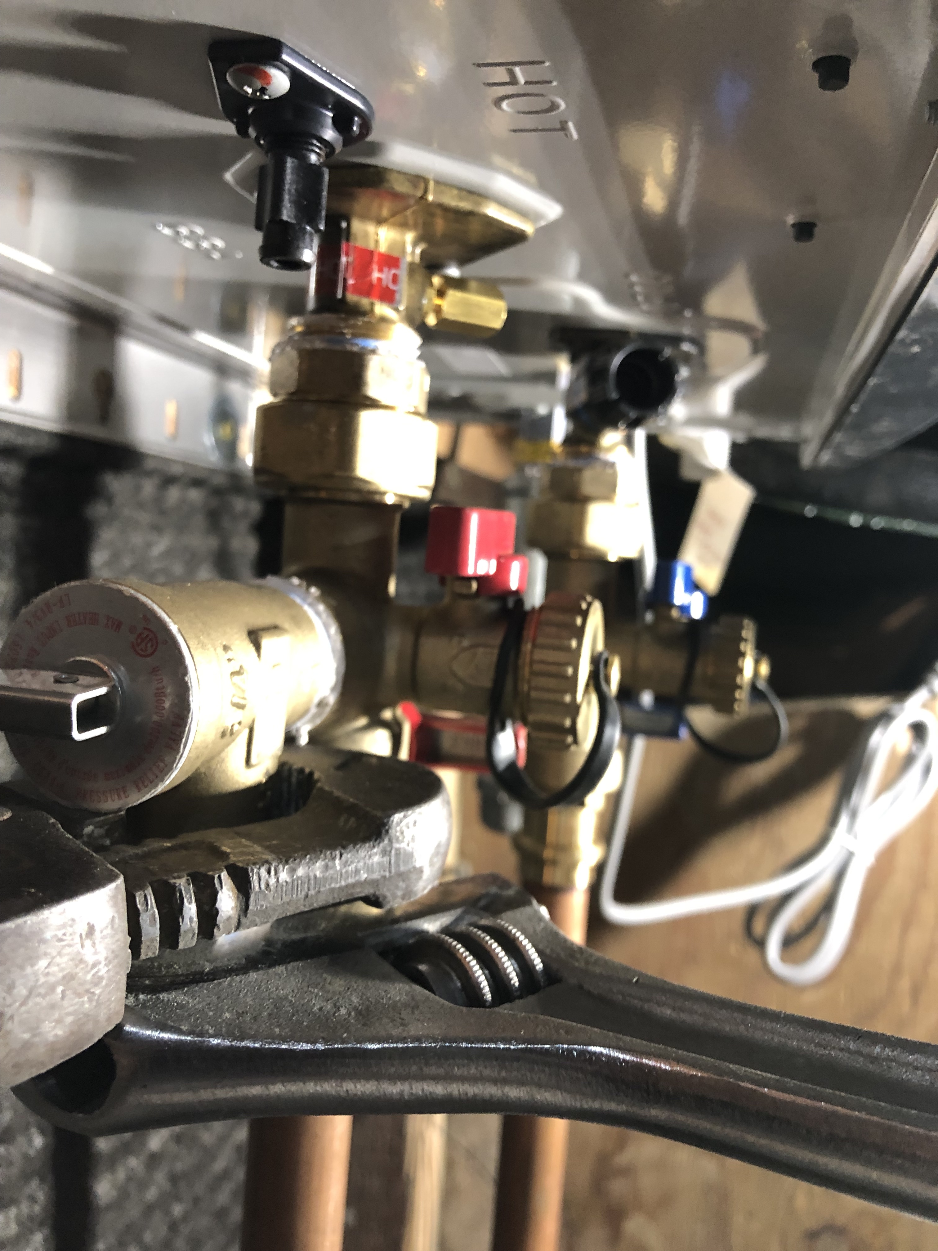 Professionally installed residential water heater, highlighting the Good Fit Plumbing brand's water heater installation and maintenance services.