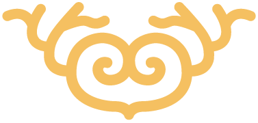 Yellow ornamental swirl design with symmetrical curls and decorative extensions.