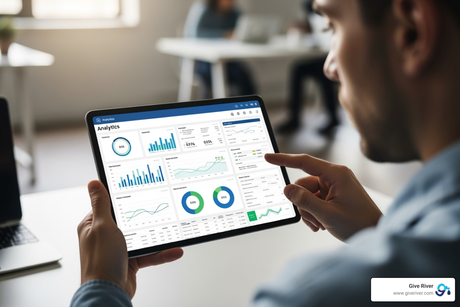 person analyzing an analytics dashboard on a tablet - staff recognition system