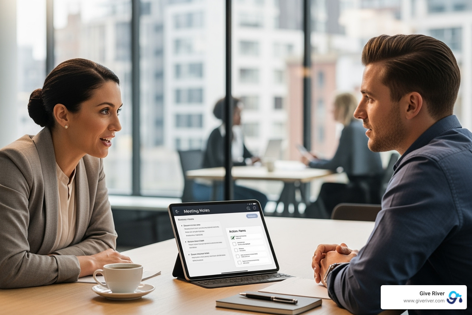 Manager and employee in a 1-on-1 meeting with a tablet