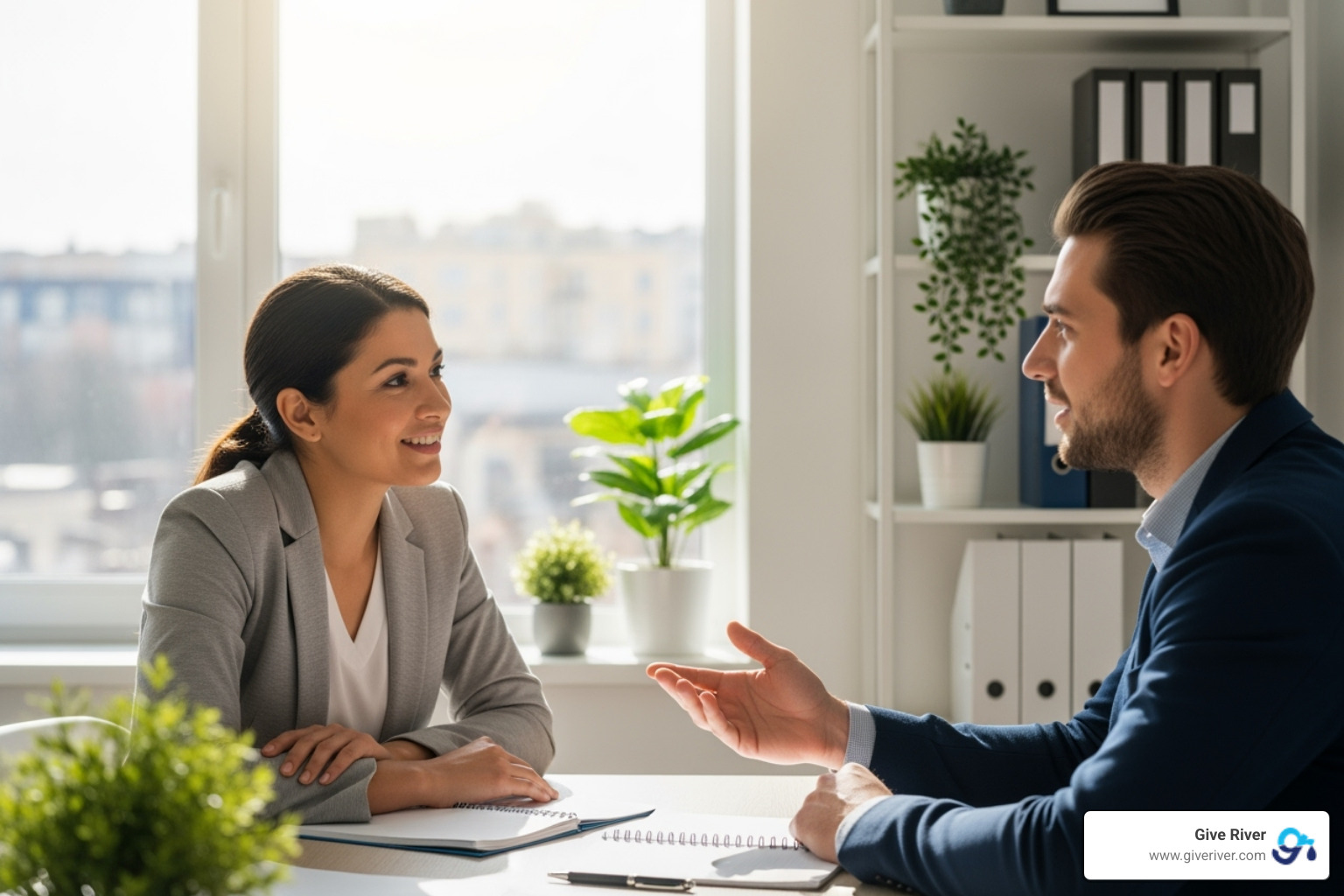 Manager and employee having a positive one-on-one meeting - modern employee recognition programs