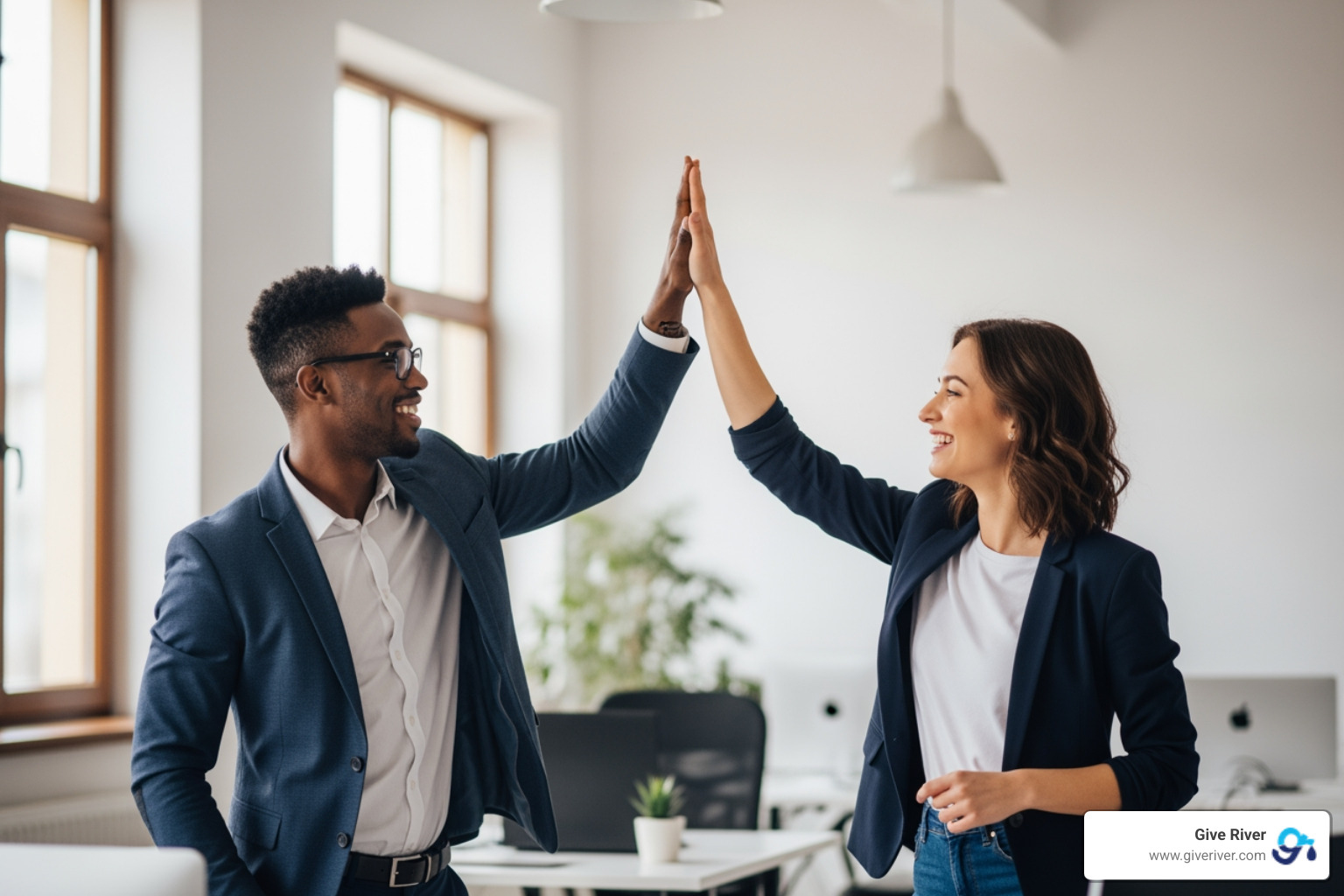 employees high-fiving in a modern office - easy team bonding games