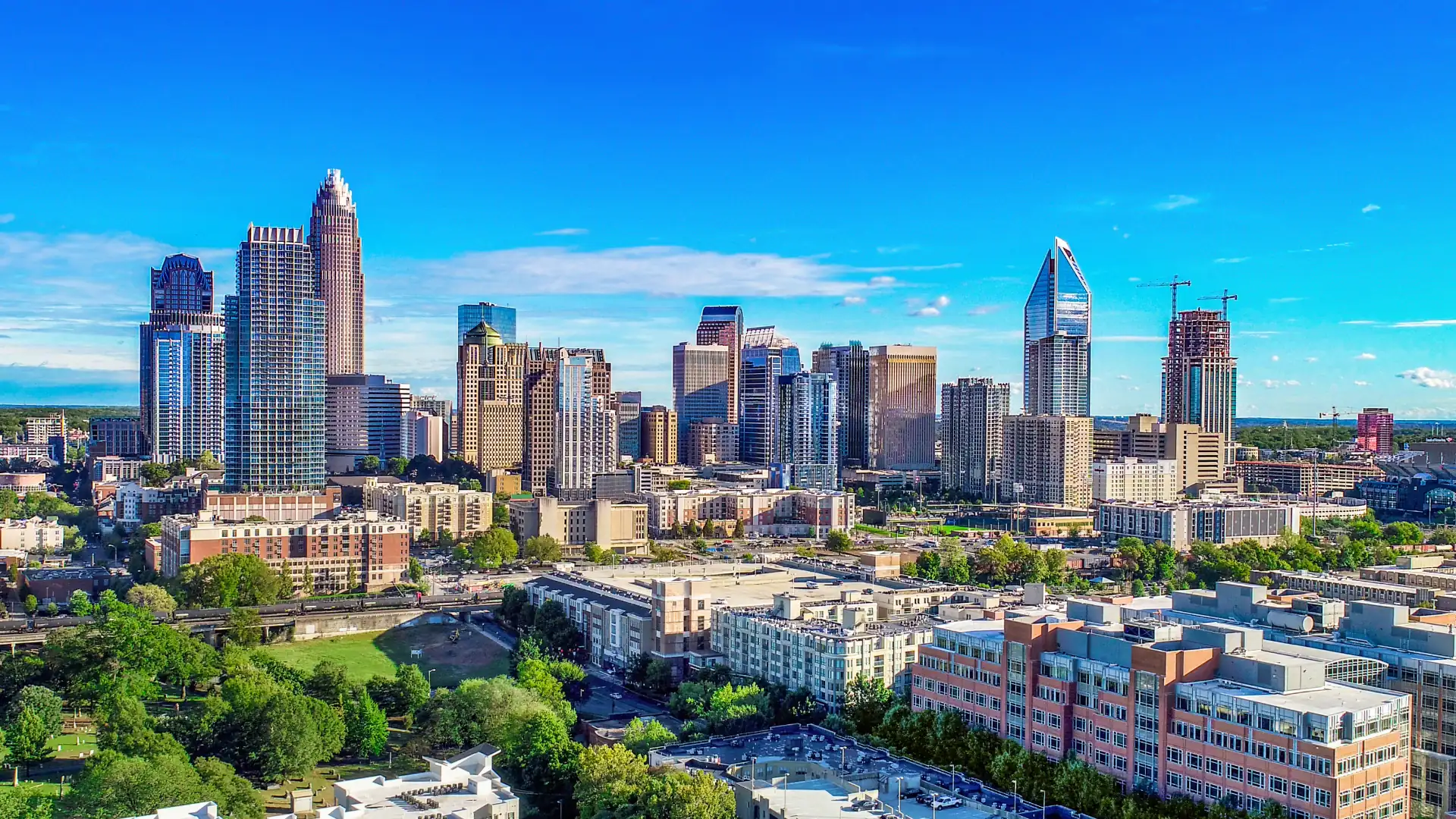 Aerial view of the Charlotte, North Carolina, skyline and tree-lined streets