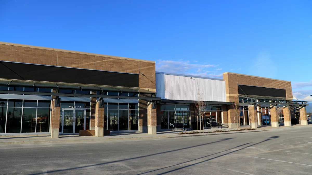 New multi-tenant strip center with stone and brick storefronts