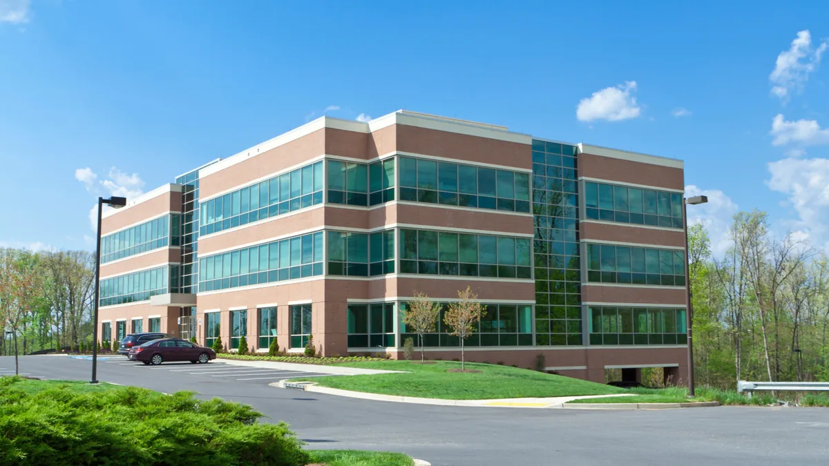 Modern suburban office building and parking lot
