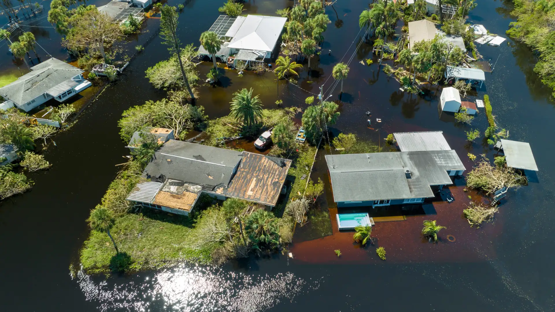 Aerial view of a neighborhood surrounded by floodwater after a hurricane