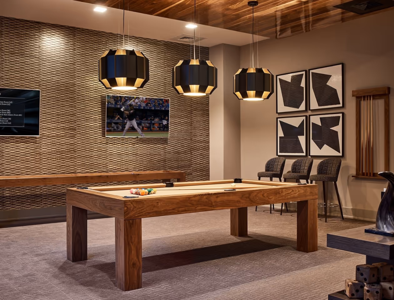 Modern Interior Design Cary -  pool table with a baseball player on the screen.  Stacy Nicole Interiors is a full-service North Carolina interior design firm. Luxury interior design in Charlotte-based at 1515 Mockingbird Lane, Suite 420, Charlotte, NC 28209. SouthPark luxury interiors.
