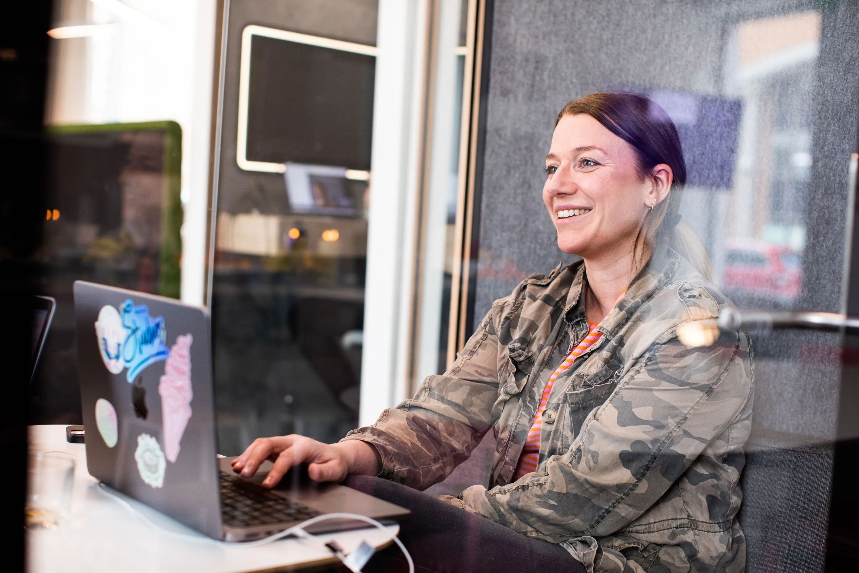Smiling employee working at her desk