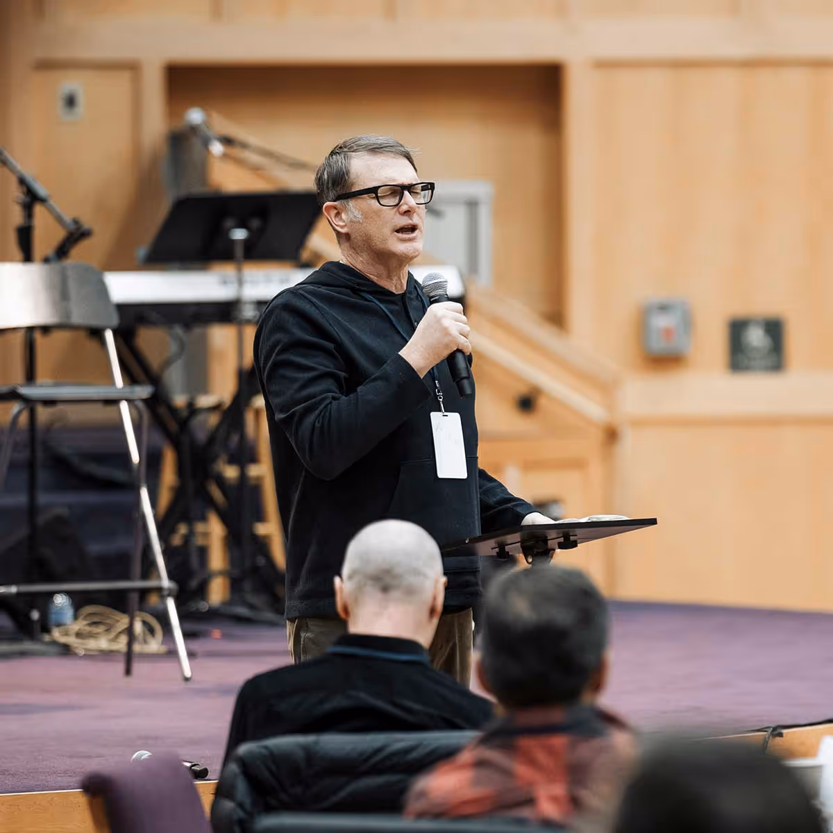 Andrew Palau praying at an event