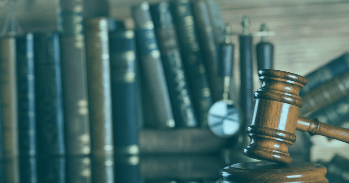 A judge's gavel and law books representing UK health and safety prosecutions and regulatory enforcement.