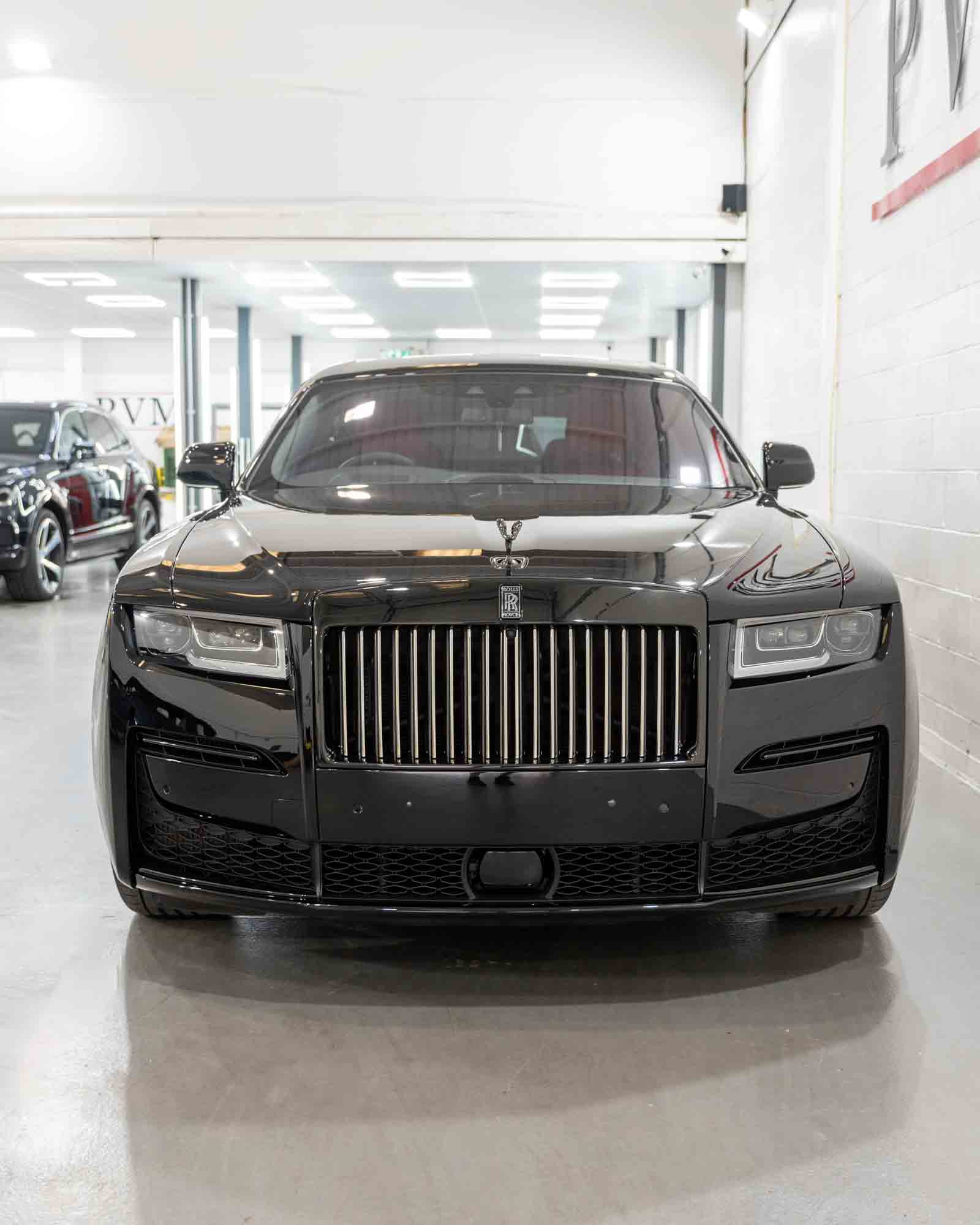 Example image of a Rolls Royce with Dechrome on the doors trims and grill area