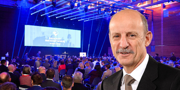 Prof. em. Dr. Giorgio Fehr; im Hintergrund das «Wifo».
