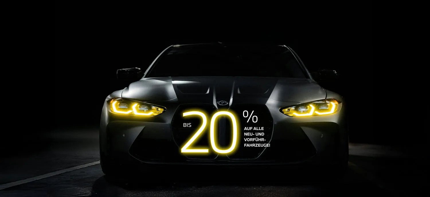 Frontansicht eines BMW mit leuchtenden Scheinwerfern und großem 20 %-Schriftzug zur Rabattaktion – BMW Wolter & Steiner in Neubrandenburg, Waren und Prenzlau