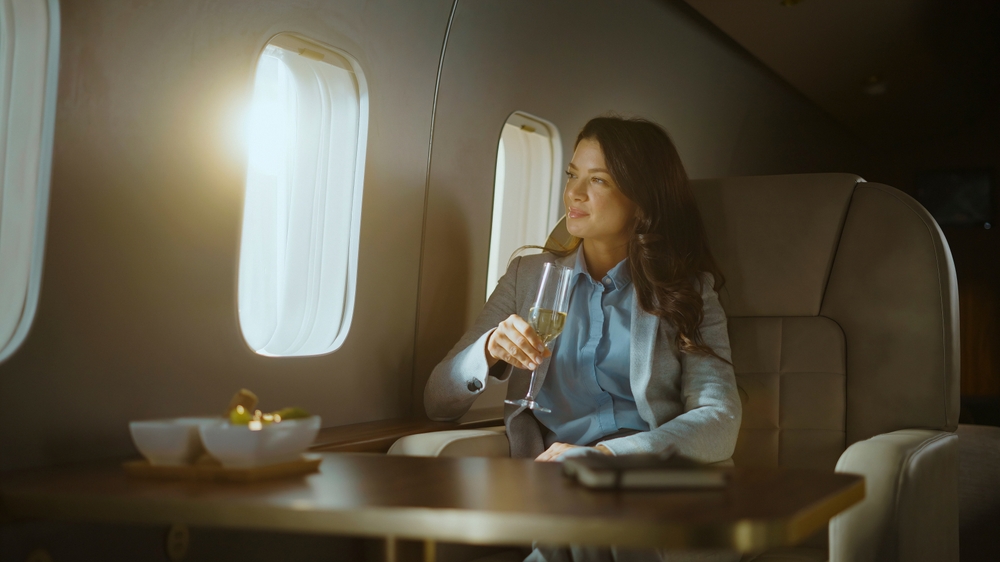 Female investor sat on a private jet bound for Portugal