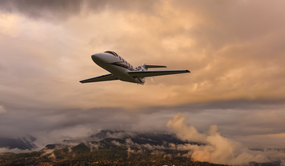 Private jet flying through the sunset in Portugal