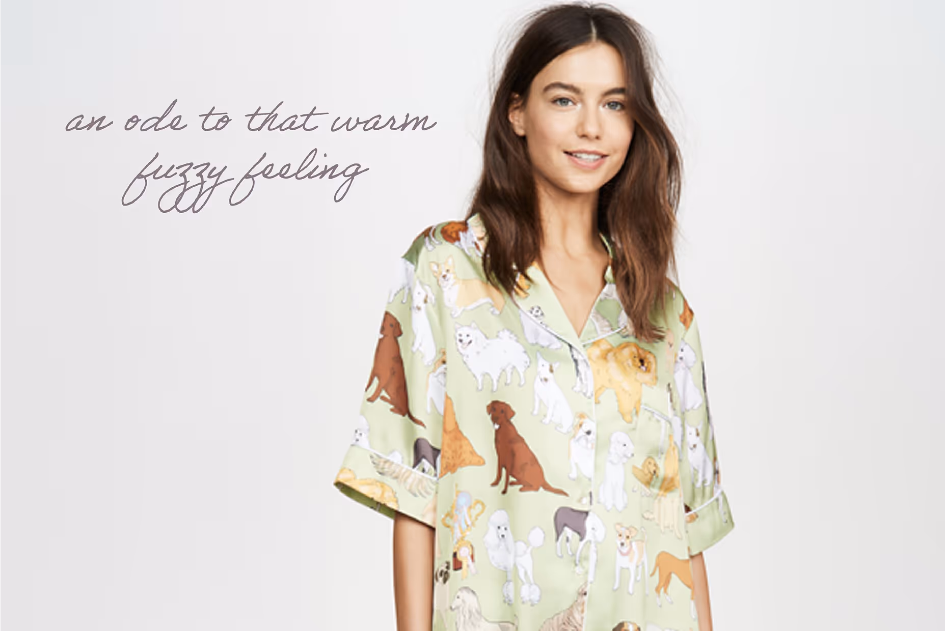 Woman smiling wearing a light green shirt covered in various dog illustrations, with cursive text saying 'an ode to that warm fuzzy feeling' in the background.