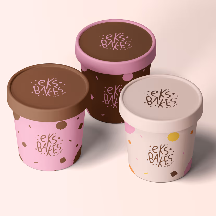 Three colorful ice cream tubs with lids, labeled 'Eks Bakes,' in pink, brown, and cream colors with decorative spots.