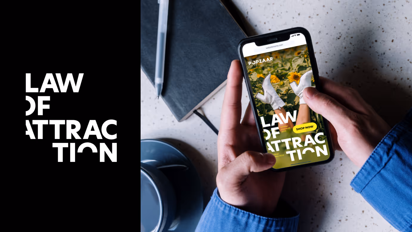 Person holding a smartphone displaying a website with the text 'LAW OF ATTRACTION' and an image of legs wearing white boots in a field of sunflowers.