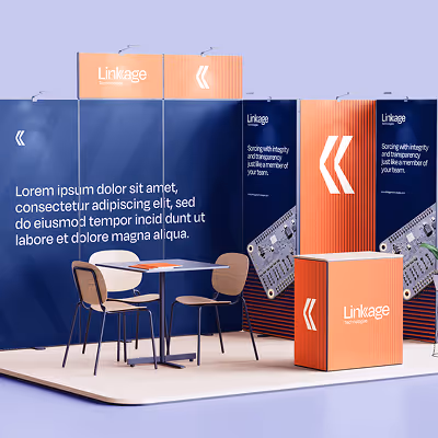 Trade show booth with navy blue and orange panels displaying 'Linkage' branding, featuring two chairs and a table on a beige floor mat.