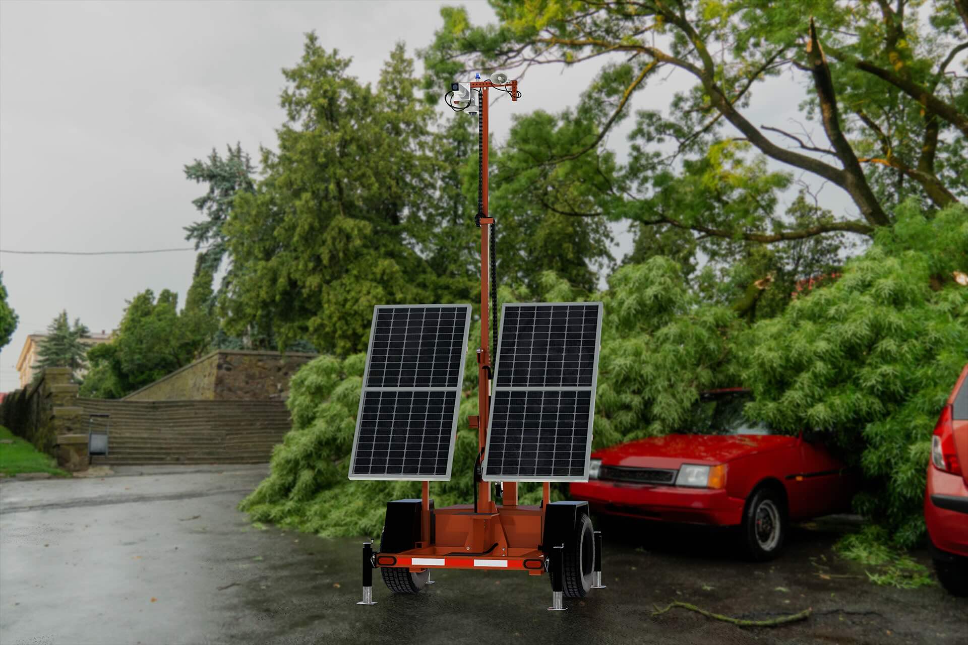 Solar-powered SmartGuard unit with red car and fallen debris in the background. 
