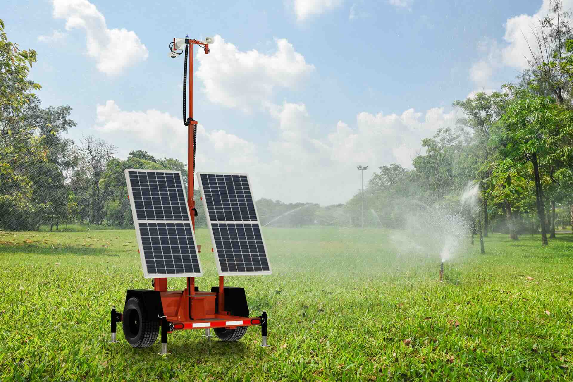 Solar trailer SmartGuard unit with cameras and speaker overseeing irrigation system of a field with trees. 